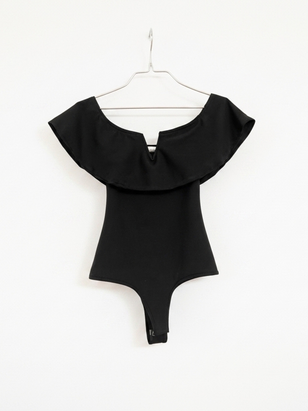 Black Off-Shoulder Ruffle Bodysuit with Notch Detail - Picture 1 of 2